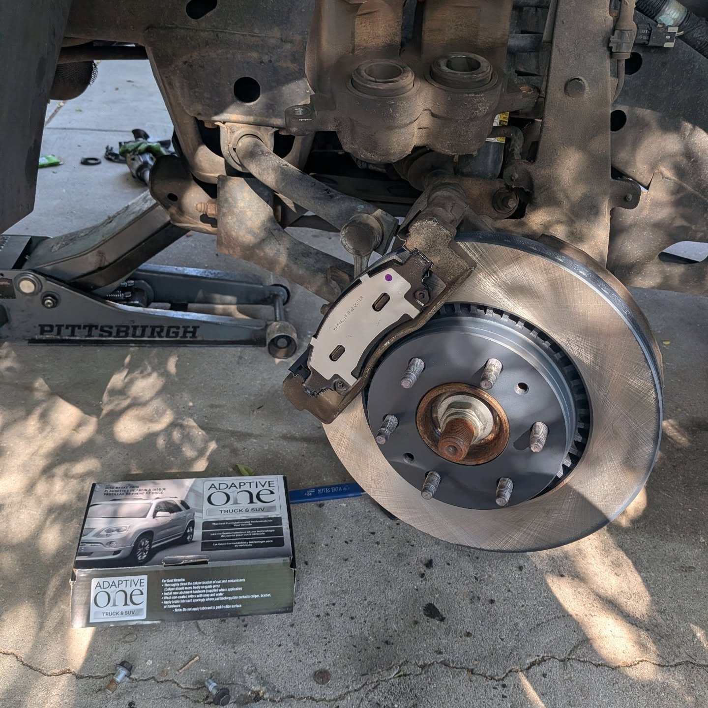 Front brake pad and rotor replacement performed on-site by a mobile mechanic in Greeley CO