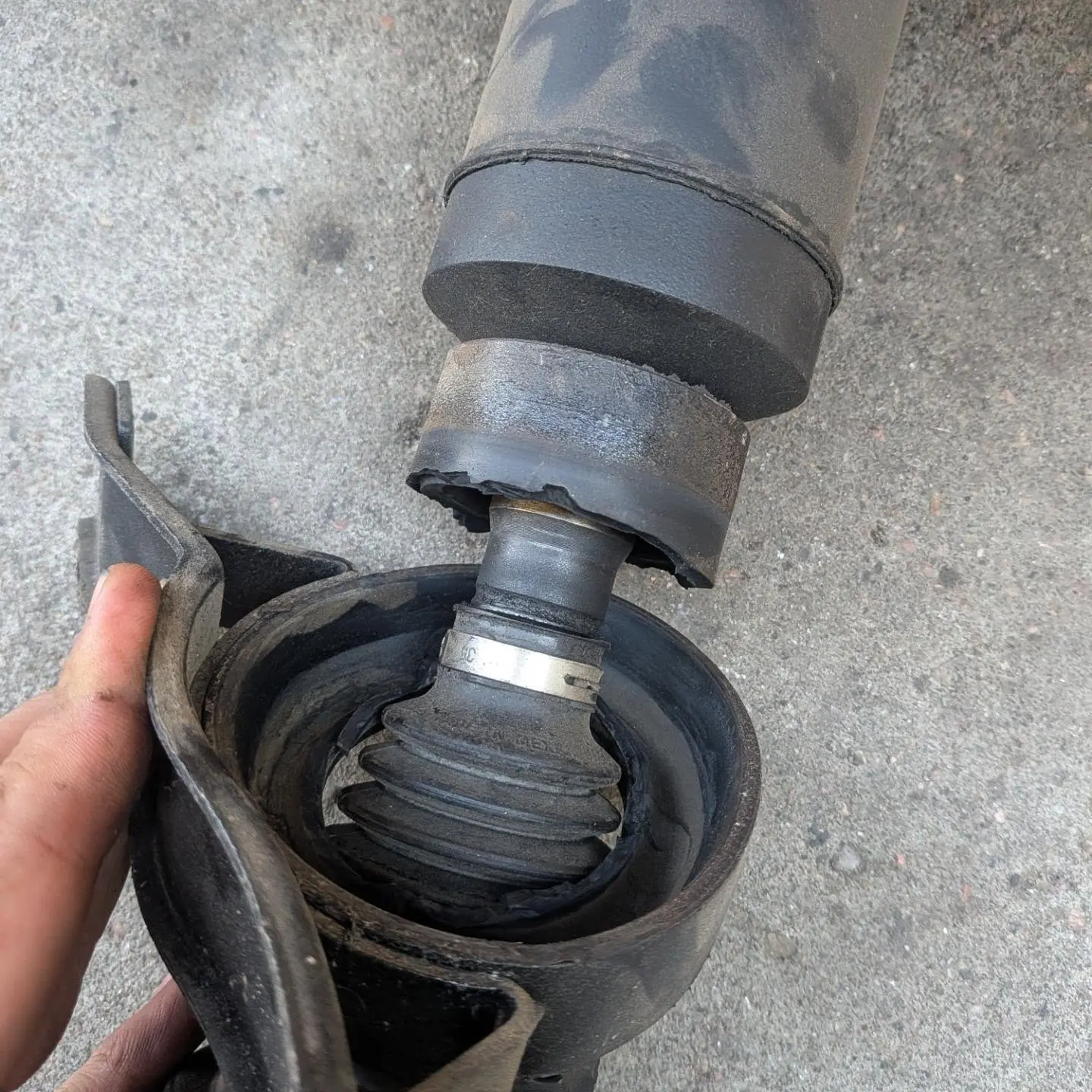 Worn CV axle and mount removed during roadside and driveline repair in Greeley CO